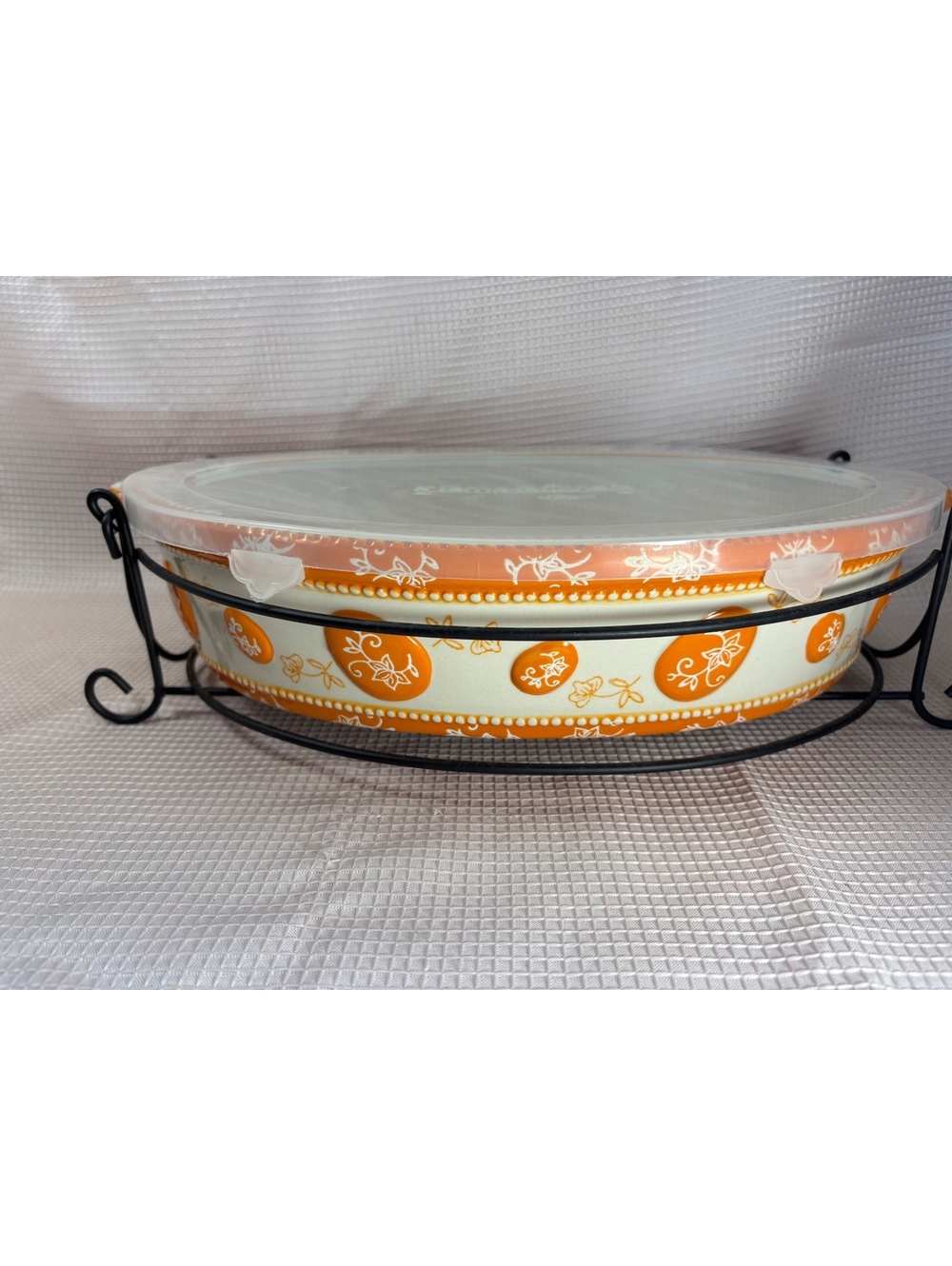 Temp-tations Ovenware ceramic bakeware feature's limited-edition Egg Hunt Orange